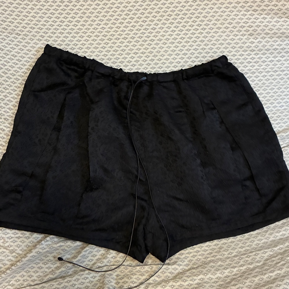 Free People black drawstring shorts with jacquard print